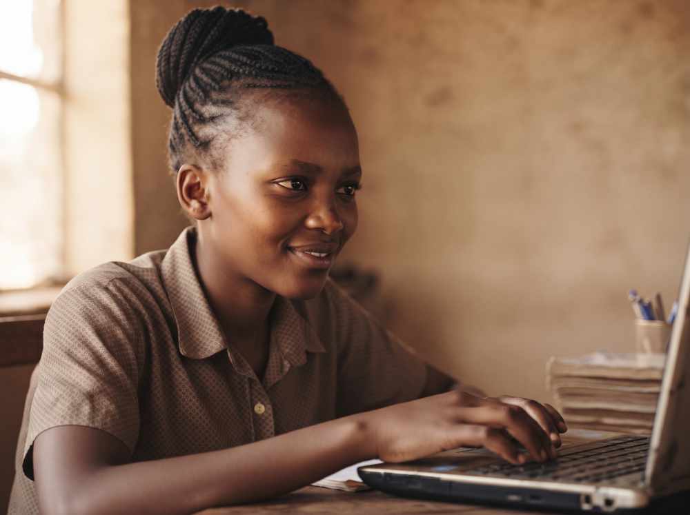 Young entrepreneur planning a small business with help from AI
